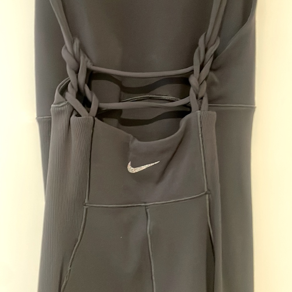 Black Nike one piece shorts , soft spandex material, unique back